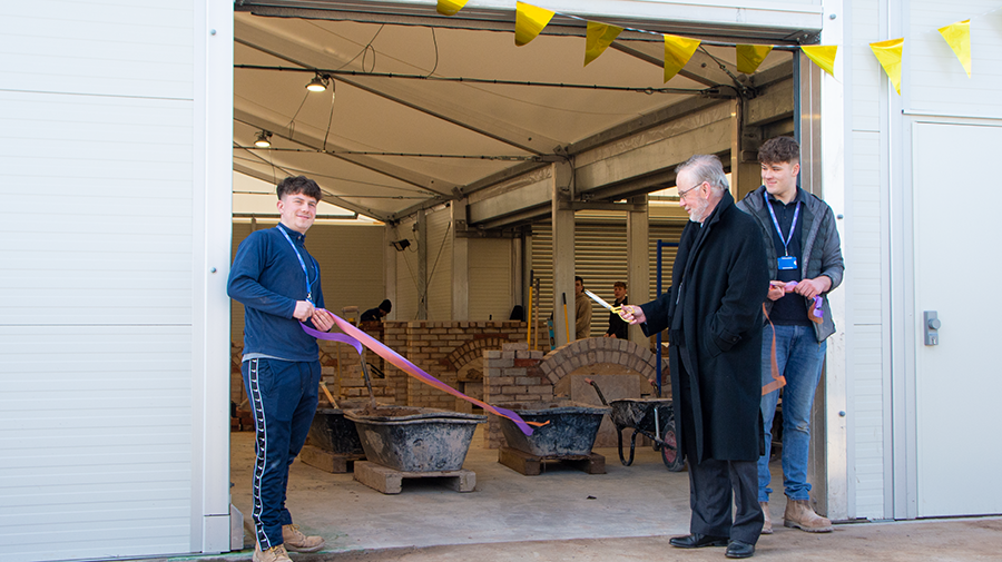 Iain Gilmour, Chair of the Radbrook Foundation, opening the Brick Workshop alongside apprentices Finnbar and Joel