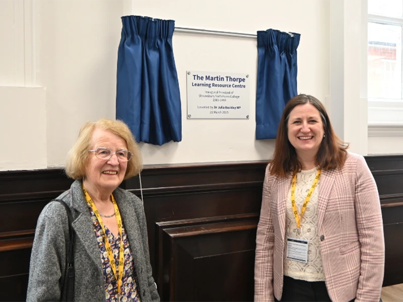 Dr Julia Buckley MP and Margaret Thorpe standing in front of plaque