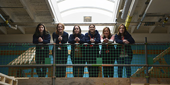 SCG's female construction staff standing on the balcony of the carpentry workshop