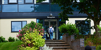 Students entering London Road Campus reception area
