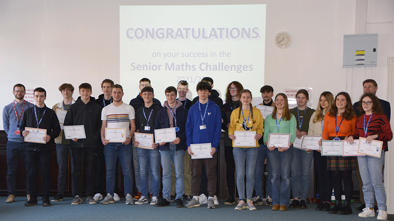 A Level Maths students pictured with their certificates from the UKMT Senior Maths Challenge