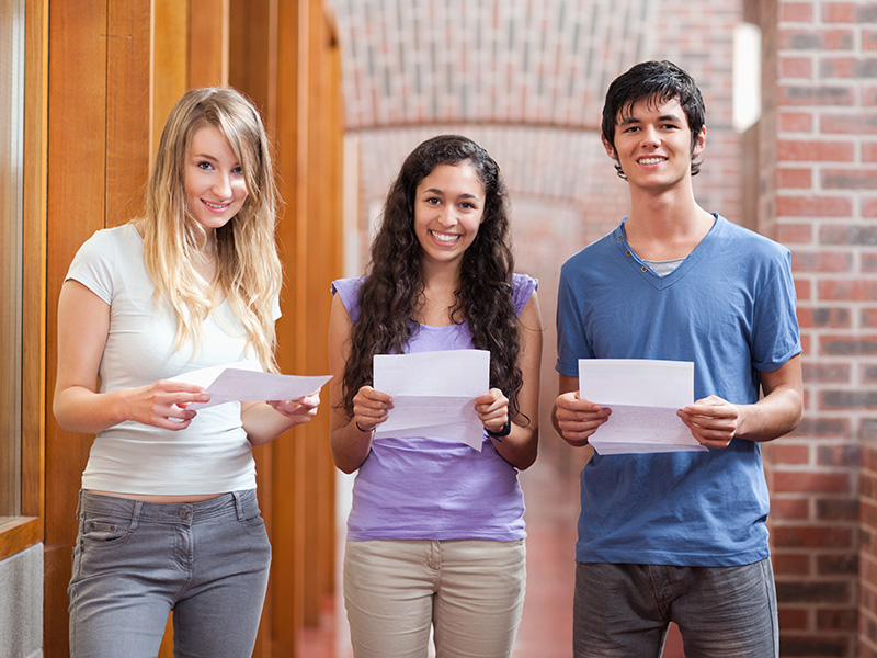 students holding exam results
