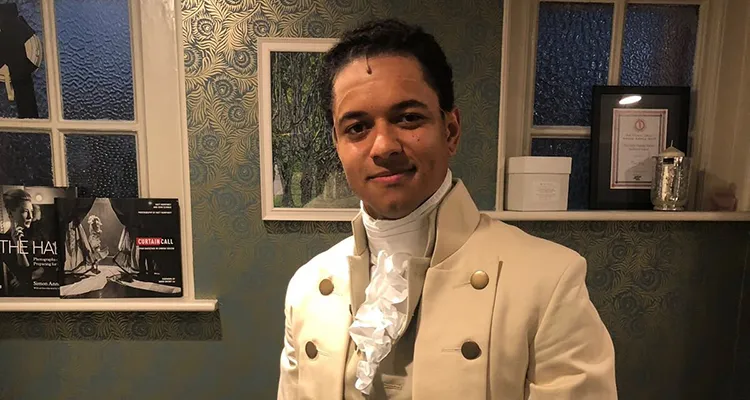 Student standing in costume