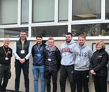 A group of students and employers from S J Roberts