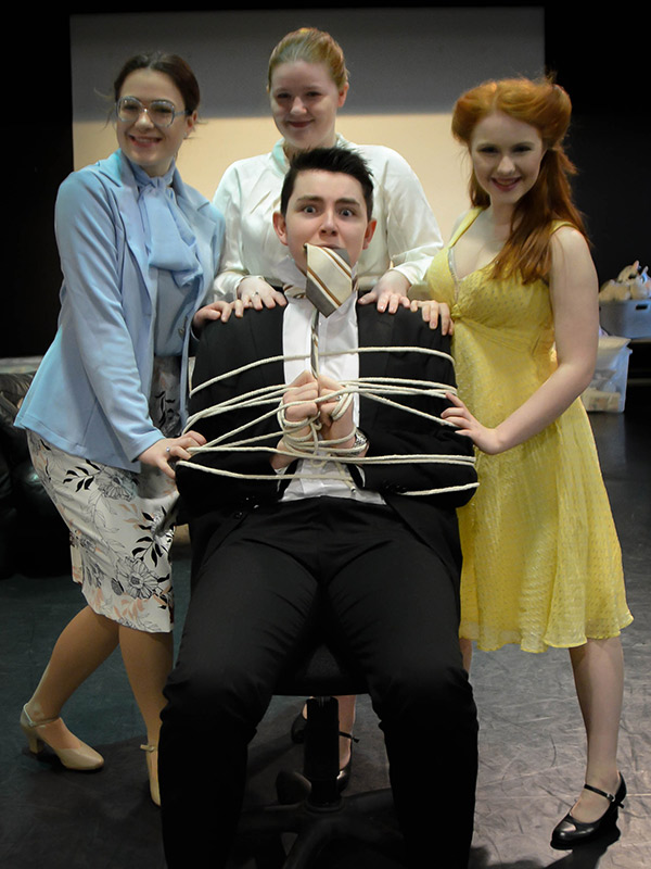 Students in costume for 9 to 5 performance
