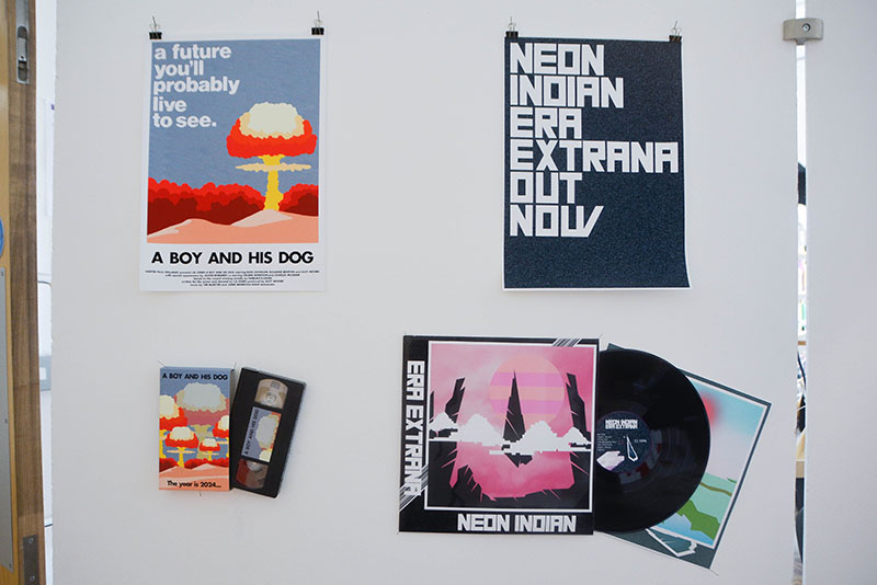 An installation with student’s artwork on posters, a record sleeve and a VHS cassette and cover.