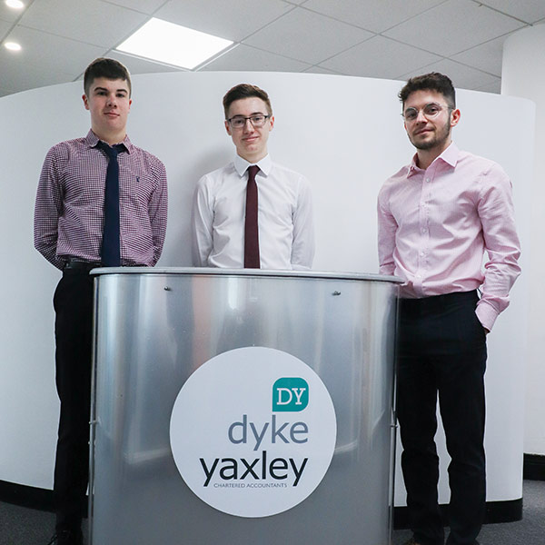 Three Accounting Apprenticeships in front of Dyke Yaxley sign