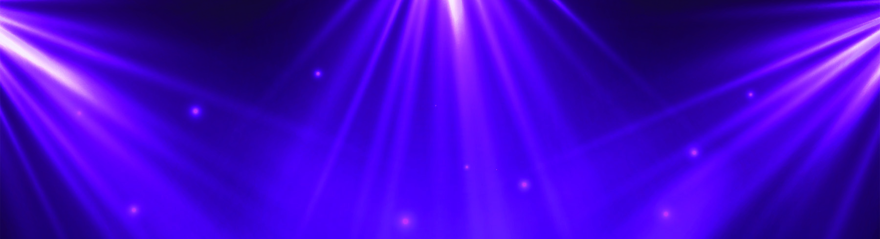 A stylised photograph of stage curtains and lighting