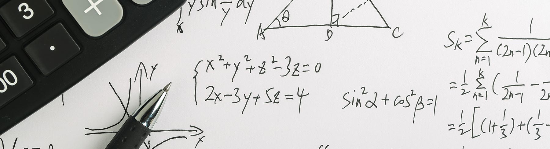 A closeup of some calculations and a calculator 